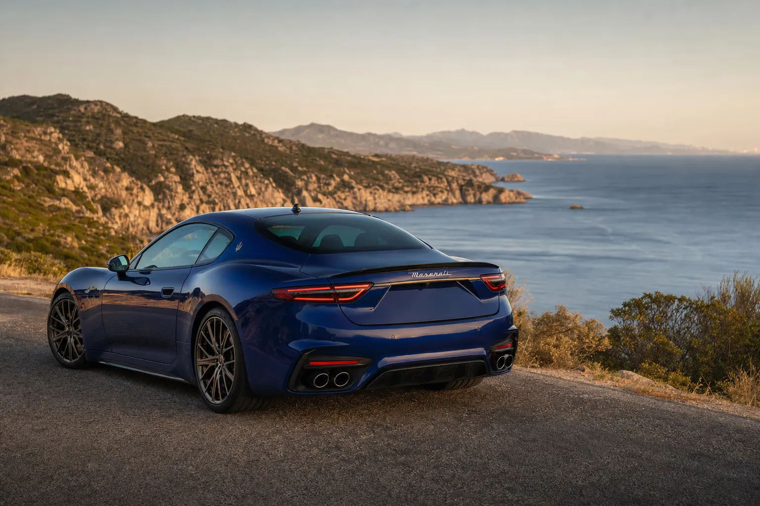 Maserati GranTurismo Trofeo on a Sardinian coastal road