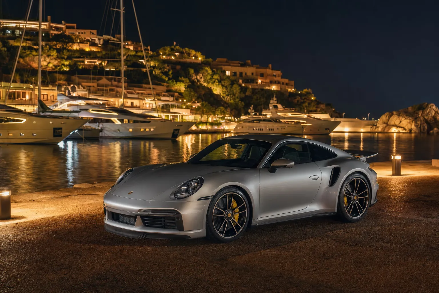 Porsche 911 Turbo at night in an exclusive Sardinian marina